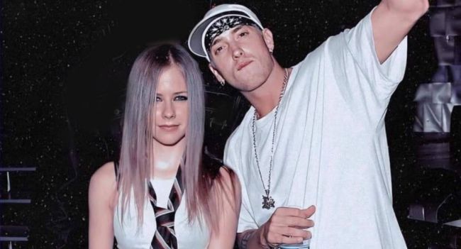 Call it punk meets pain. Rage meets romance. In one of the most unexpected collaborations of the year, rap titan Eminem and pop-punk icon Avril Lavigne have joined forces for a brooding, emotional track titled “I’ll Follow You.” The song blends Avril’s raw, grunge-tinged vocals with Eminem’s trademark lyrical fire — telling the story of two broken souls who can’t let each other go, no matter how far they fall. “If I’m going to hell,” Em spits in one verse, “I’ll follow you just to burn beside you.” And just like that, the internet went nuclear. Call it punk meets pain. Rage meets romance. In one of the most unexpected collaborations of the year, rap titan Eminem and pop-punk icon Avril Lavigne have joined forces for a brooding, emotional track titled “I’ll Follow You.” The song blends Avril’s raw, grunge-tinged vocals with Eminem’s trademark lyrical fire — telling the story of two broken souls who can’t let each other go, no matter how far they fall. “If I’m going to hell,” Em spits in one verse, “I’ll follow you just to burn beside you.” And just like that, the internet went nuclear.